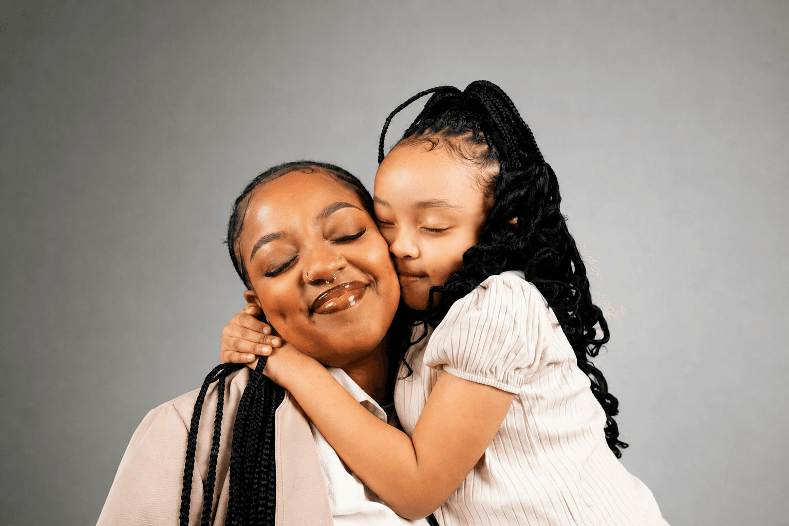 A mother and daughter sharing a warm embrace